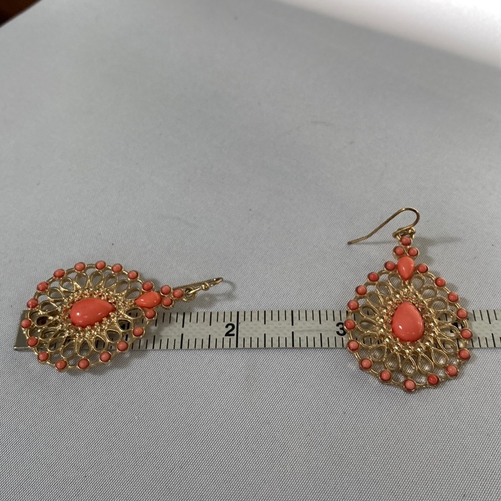 Dangling teardrop open scrollwork Goldtone earrings